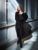 Black mink fur coat with fox fur collar, side view holding lapel