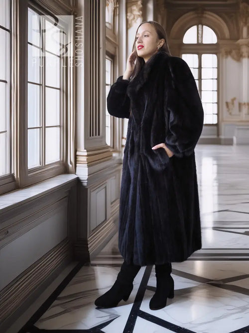 Black mink fur coat with fox fur collar, three-quarter view