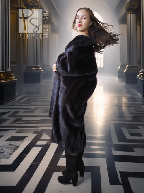 Long black mink fur coat with wide collar; full-length side profile.