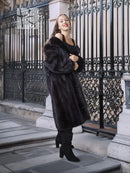 Black mink fur coat with wide collar, full-length outdoor standing pose