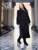 Black mink fur coat with fox fur collar, front view in archway