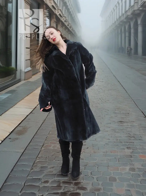 Dark mink fur coat with button-front and high collar, full-body street view.