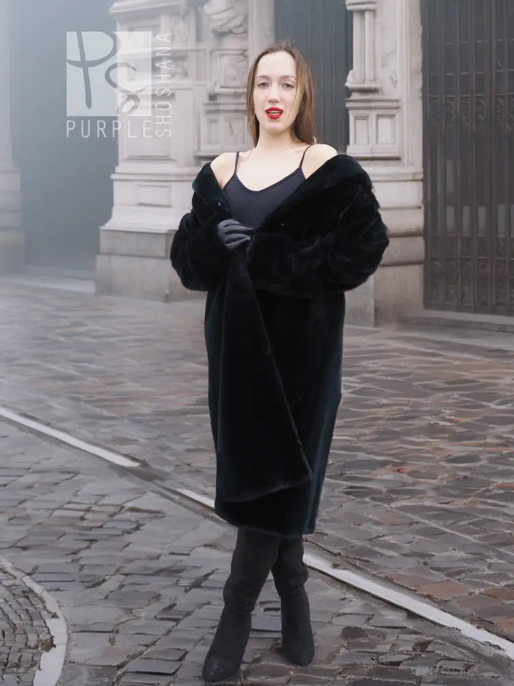 Mink fur coat, dark color, close front view with wide cuffs and V-neck opening