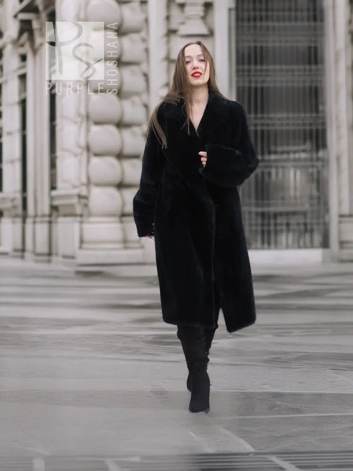 Black mink fur coat with V-neck, button front, long sleeves, and knee-length cut.