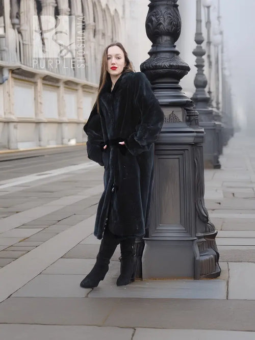 Mink fur coat, dark color, three-quarter front view with button-front and long fit