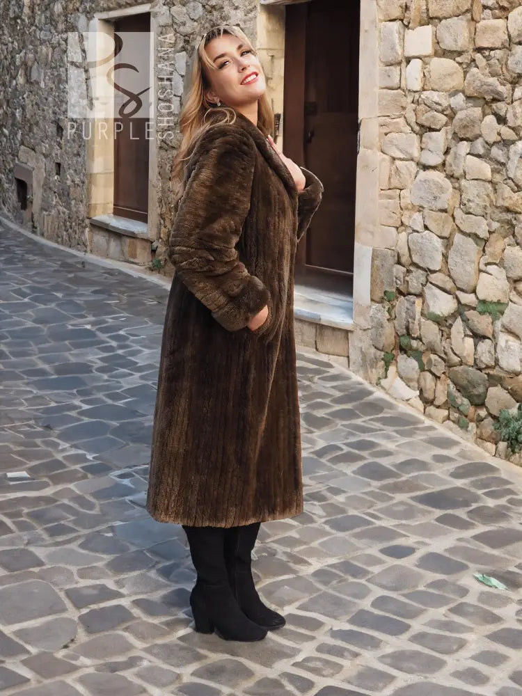 Sheared beaver fur coat, long dark brown, side view with thick fur texture