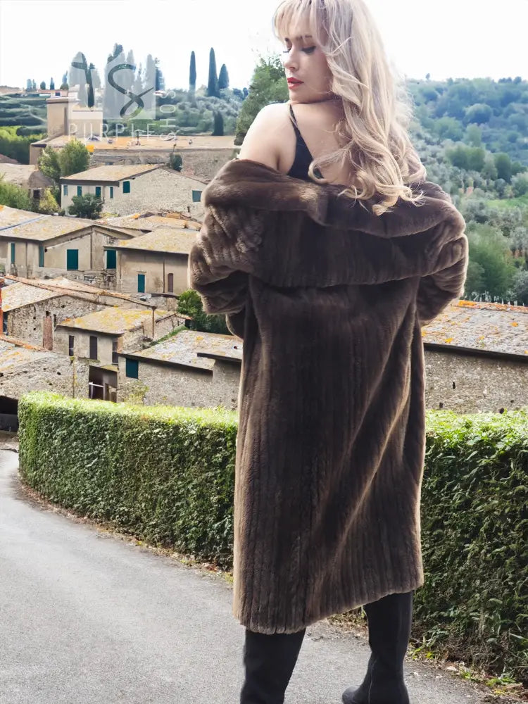 Long dark brown beaver fur coat with wide collar and horizontal textured panels
