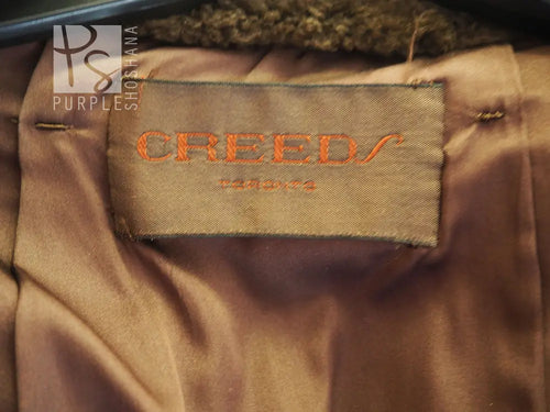 Creeds beaver fur coat interior label on tan fabric