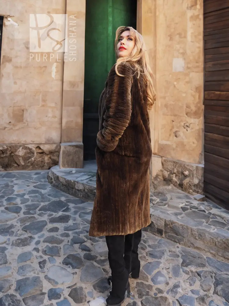 Sheared beaver fur coat in dark brown, full length with plush texture and stand collar