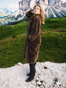 Long brown sheared beaver fur coat with straight silhouette and textured sleeves