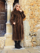 Long sheared beaver fur coat in rich brown with high collar and soft, textured finish