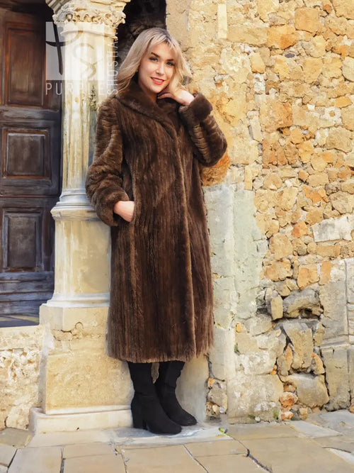 Long sheared beaver fur coat in rich brown with high collar and soft, textured finish