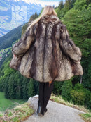 Silver fox fur coat long jacket, rear view with voluminous gray and black fur