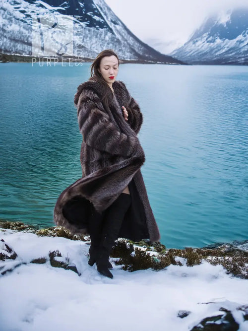 Hooded long raccoon-fur coat in dark brown with striped body and open front