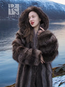 Hooded fur coat with dark brown textured sleeves and oversized collar trim.