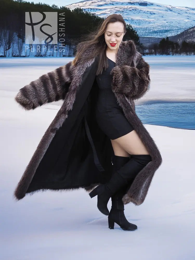 Long hooded fur coat with dark brown texture, wide cuffs, and open front