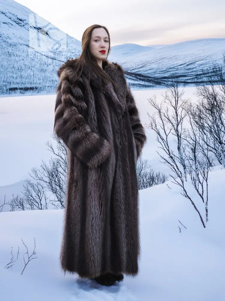 Long dark brown hooded fur coat with full-length sleeves and open front.