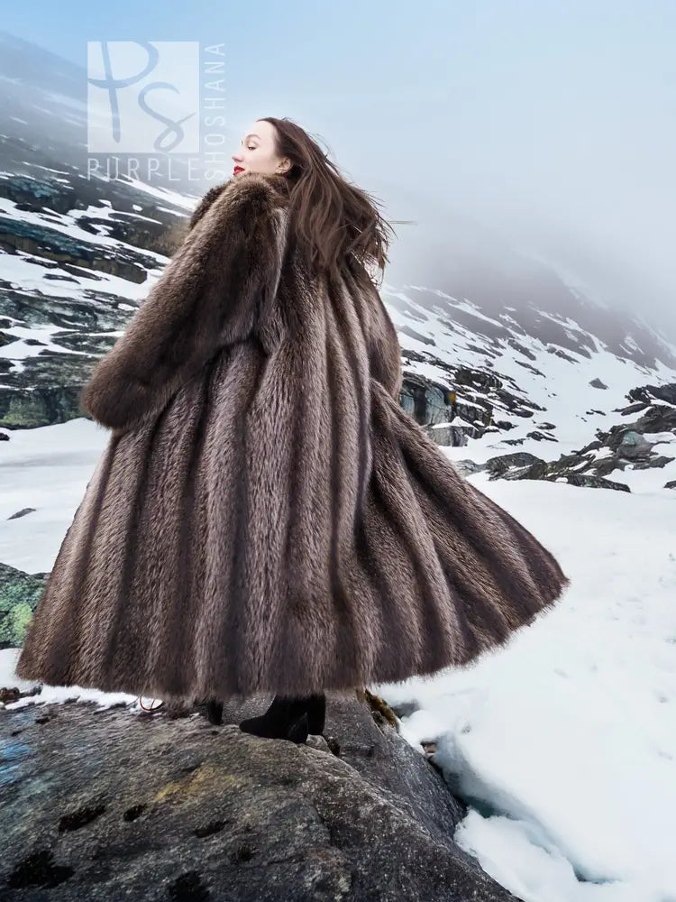 Flared long raccoon fur coat with high collar and dark brown shaggy texture