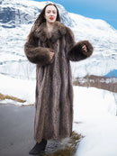 Long hooded raccoon fur coat in dark brown, relaxed fit with cuffed sleeves.