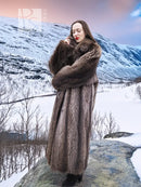 Long dark brown raccoon fur coat with hood and thick collar, wrap-style arm fold.