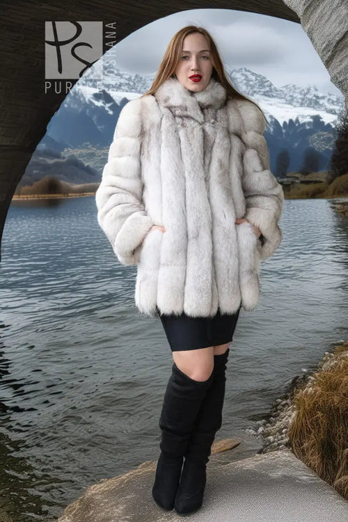 Cream fur jacket with rounded collar, chunky sleeve texture, and flared hem