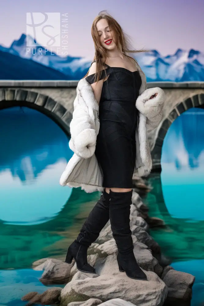 Light white fox fur jacket draped open at the front with bulky fur sleeves