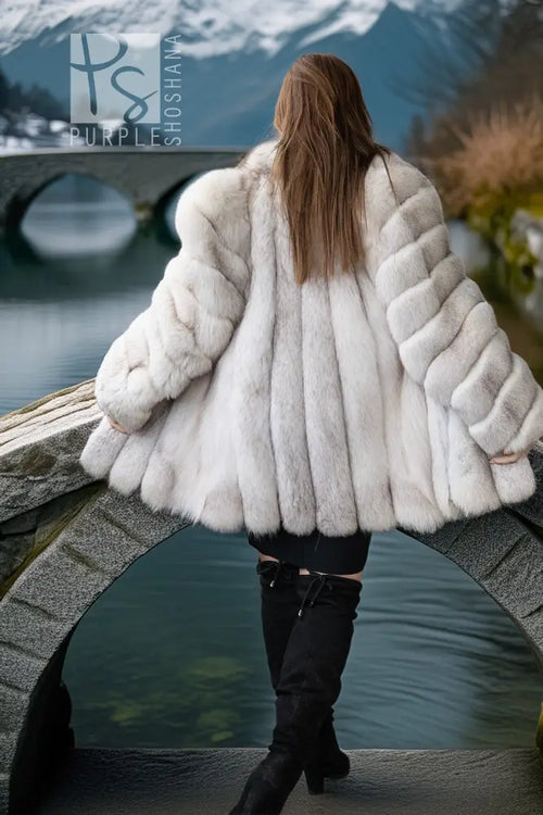 Light white fox fur jacket shown from the back with thick horizontal fur panels