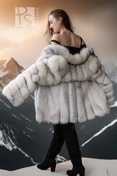 Cream fur jacket with wide off-shoulder neckline detail, plush sleeves, and straight front