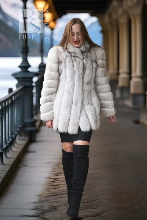 Light fur jacket with ribbed sleeves, straight front panels, and plush crew neckline