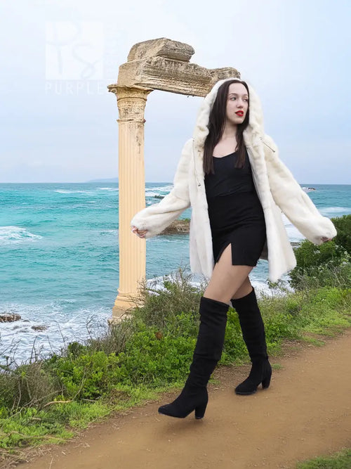 Mink fur hooded coat in light cream, front side view with hood and long sleeves.