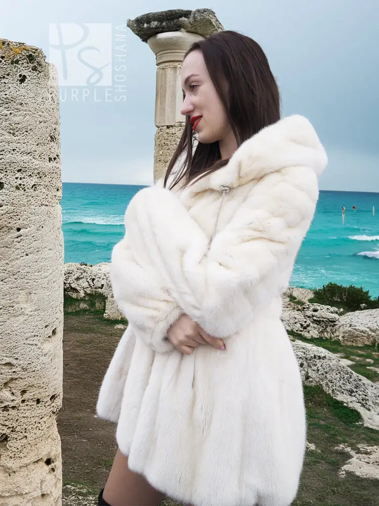 Women’s mink fur hooded coat, light beige, 3/4 side view with layered hood design