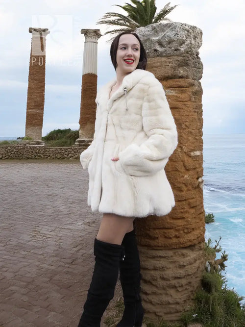 Mink fur hooded coat with full sleeves, light cream plush texture, knee length.