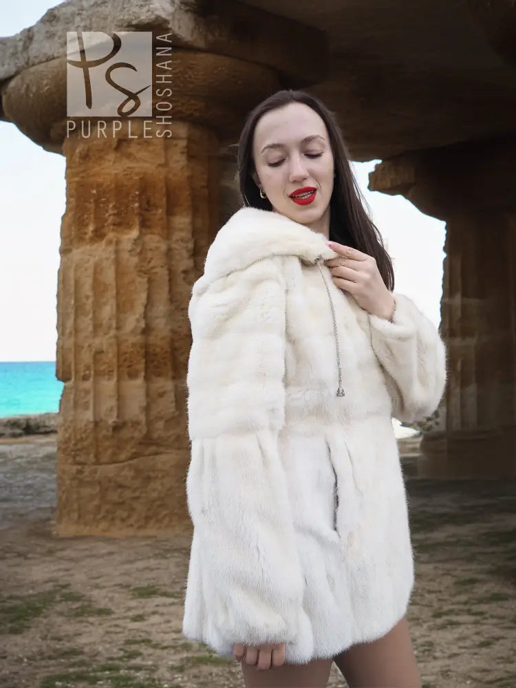 Women’s mink fur hooded coat, light beige, front view with raised collar and button detail