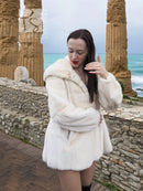 Women’s mink fur hooded coat, light beige, close side view with gathered waist shape