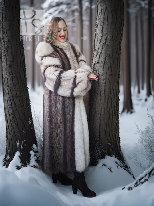 Raccoon fur coat with fox trim, long straight silhouette, and striped black-and-white fur
