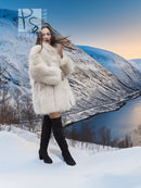 Soft Plush Blush Fox Jacket S/M featured in a snowy mountain scene, emphasizing its full fur texture and luxurious winter appeal.