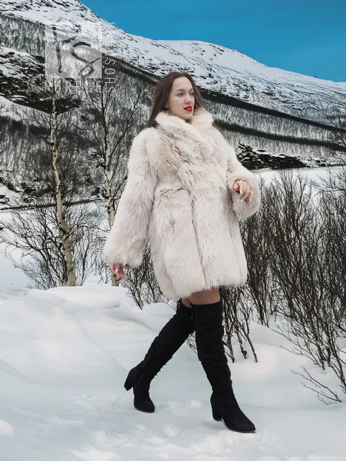 Soft plush fur jacket with relaxed fit, long sleeves, and side pockets.