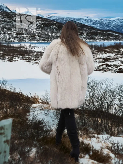 Soft plush fur jacket shown from the back, full sleeves and straight hem.
