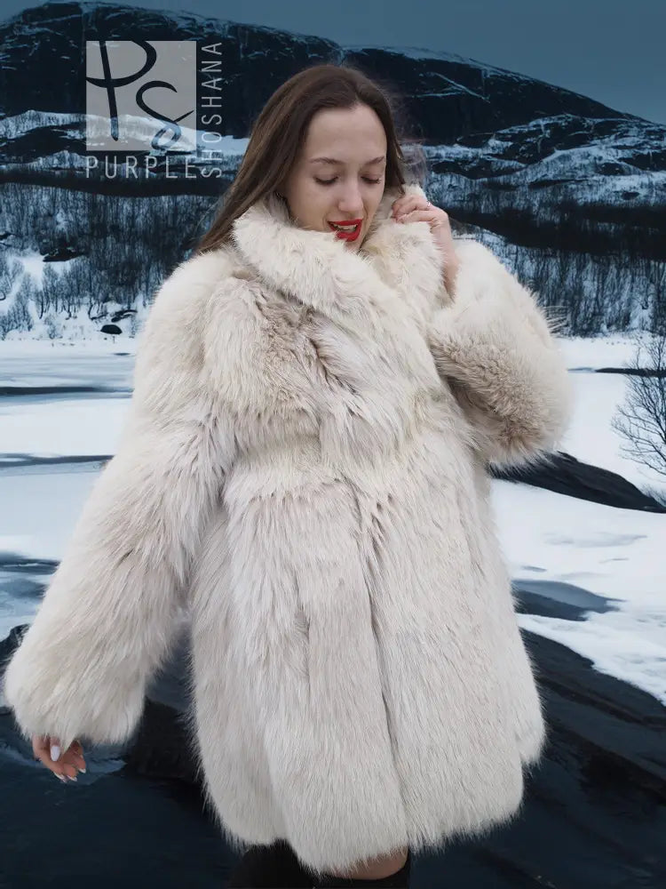 Cream plush fur jacket with close-up collar and layered textured panels