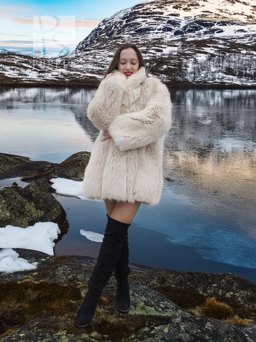 Soft plush fur jacket with open front, long sleeves, and knee-length cut.