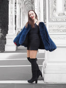 Blue faux fur jacket with short length, wide sleeves, and open front