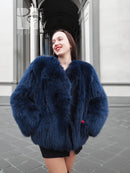 Vibrant blue faux fur jacket with plush collar and long sleeves, front view