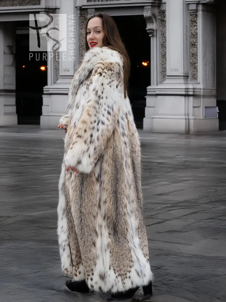 Long spotted plush fur coat with shawl collar, full-length drape, cream and dark speckle