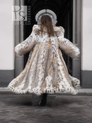 Back view of long spotted plush fur coat with shawl collar, full skirt flare