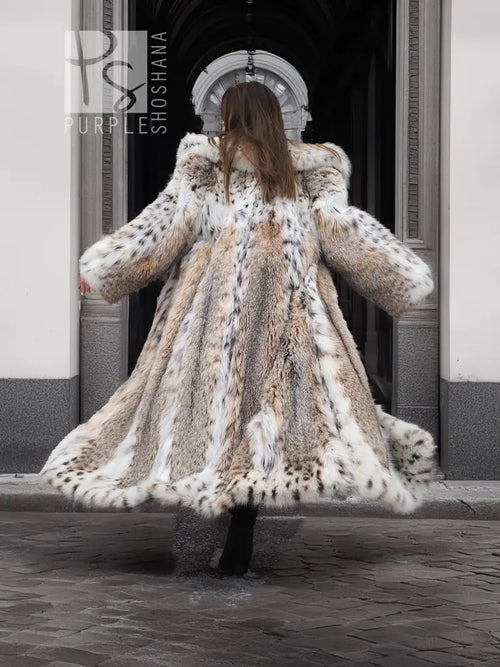 Back view of long spotted plush fur coat with shawl collar, full skirt flare