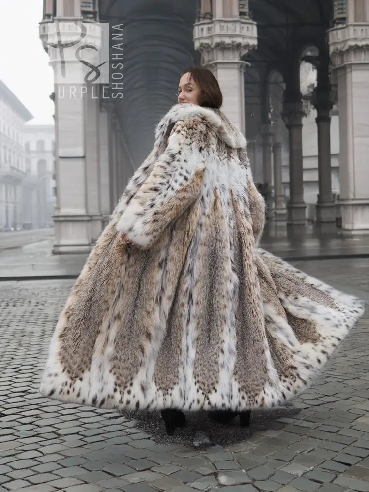 Spotted plush fur coat with shawl collar, full-length flowing hem and long sleeves