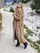 Tan hooded mink fur coat with long length and herringbone chevron texture