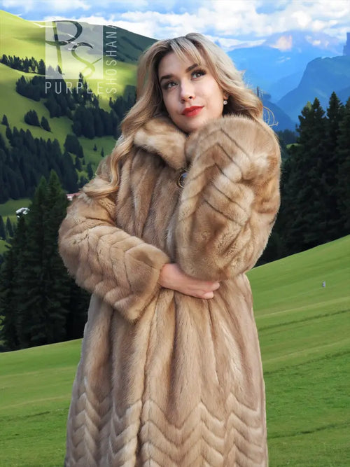 Tan mink fur coat with hood, chevron/herringbone pattern and single front button.