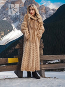 Long tan mink fur coat with hood, chevron/herringbone pattern, single front button.