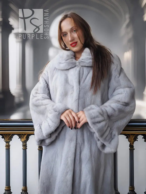 Light gray mink coat with petal collar and soft textured finish, long sleeves and relaxed silhouette.